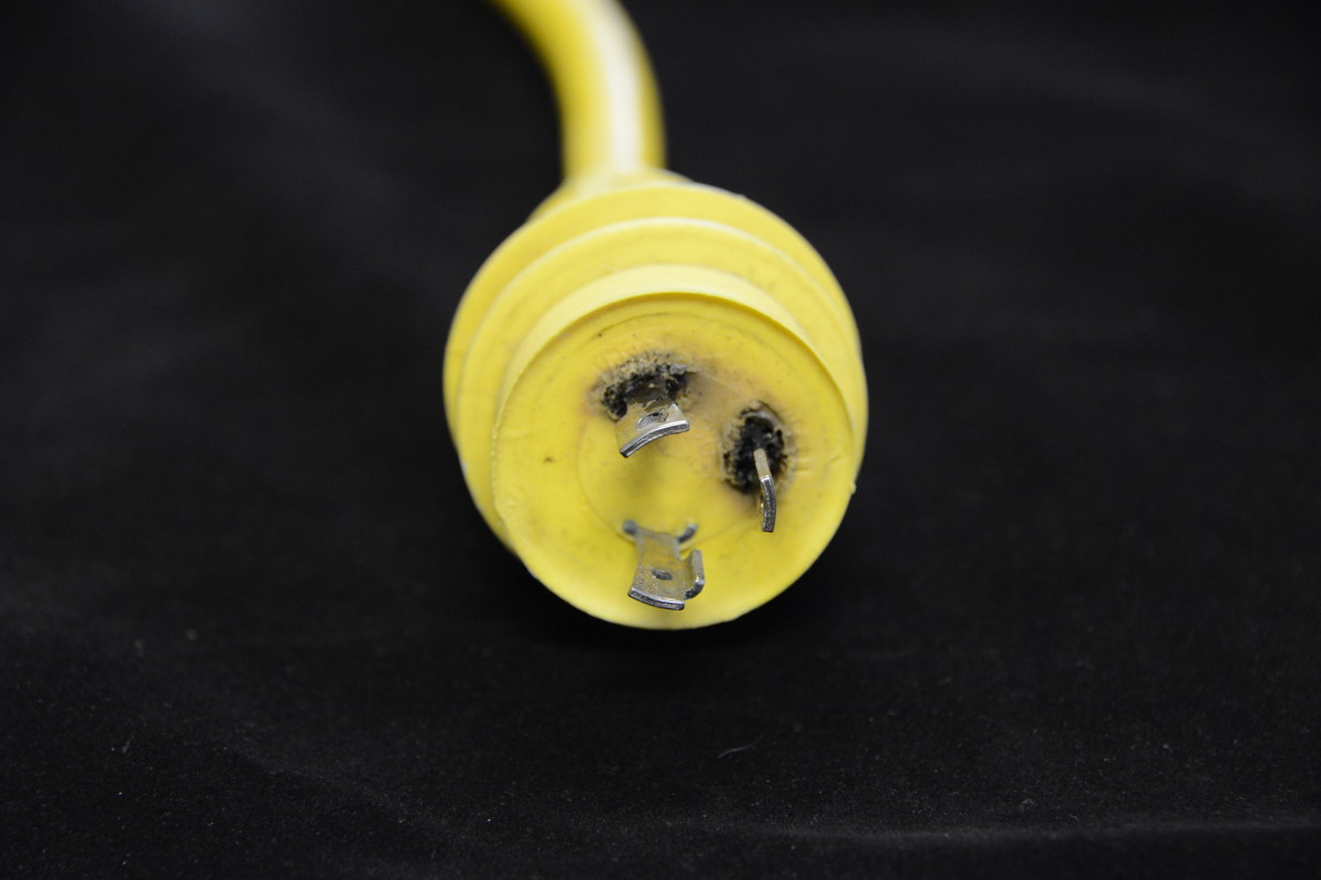 Overheated Plug: An all too common sight—this plug has been damaged by high temperatures from high resistance in the connection. Once damaged in this way, the connector must be replaced.