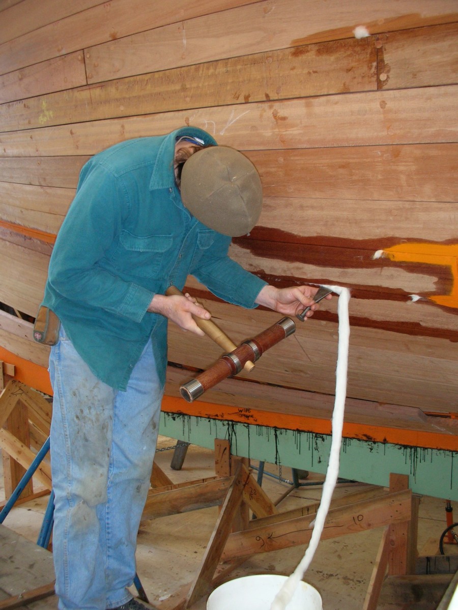Cotton strips are inserted between the planks to water-tight the hull.