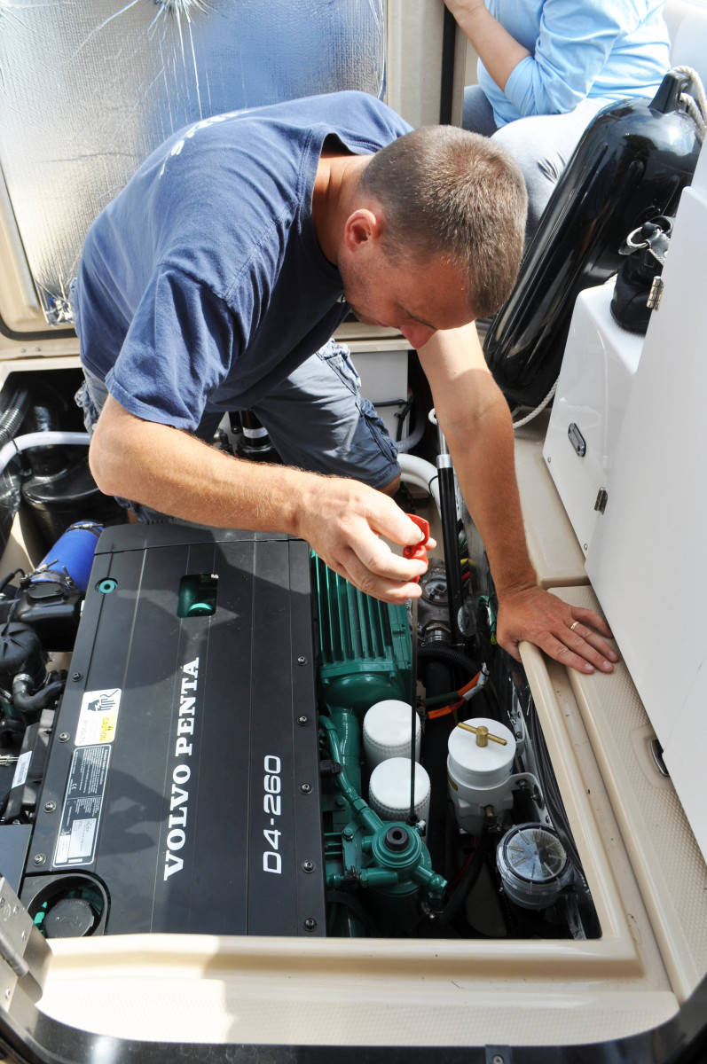  Jeremy of Hamlin Marina checks our fluids. Cutwaters are powered by Volvo Penta D Series motors, in our case a 260 hp D4.