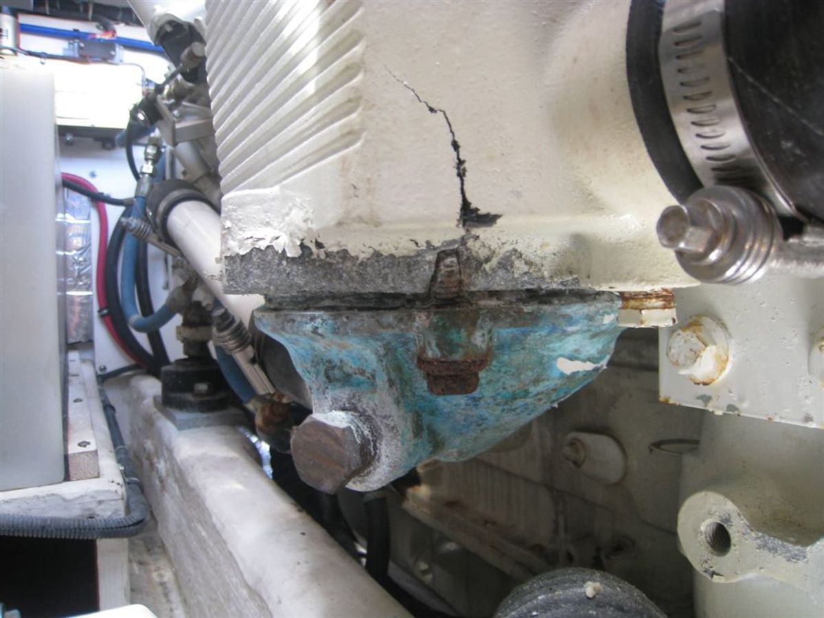 The air cooler failed due to corrosion. The cast aluminum housing has cracked and failure is imminent. The brass hex plug holds a sacrificial zinc. (Photo credit: Seaboard Marine)