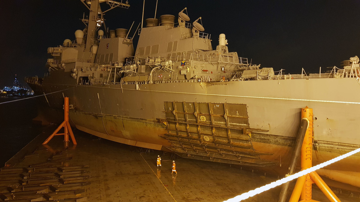 USS McCain on a heavy lift ship