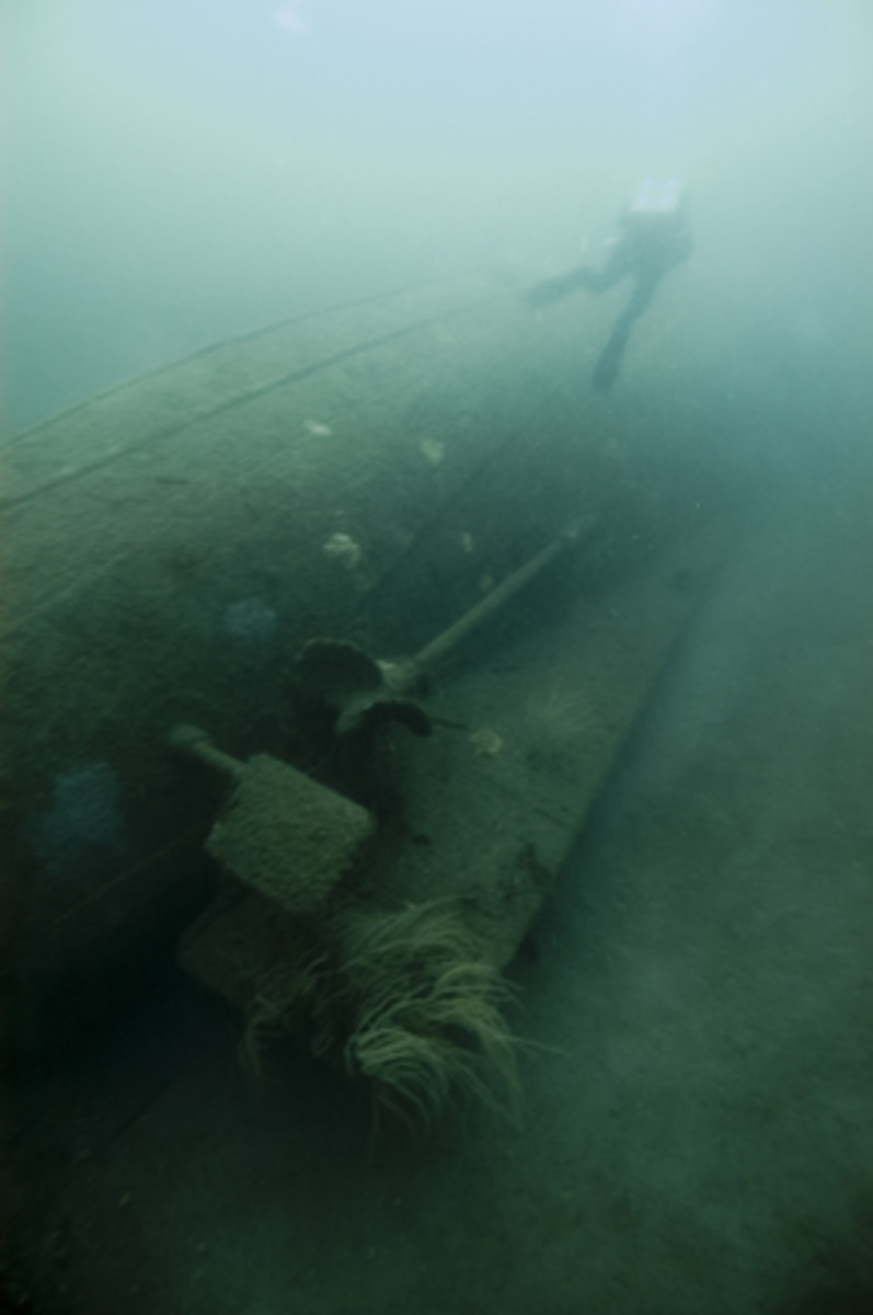 National Oceanic and Atmospheric Administration divers examine the stern of the Bedloe showing its twin rudders and screws. Photo courtesy of National Oceanic and Atmospheric Administration.