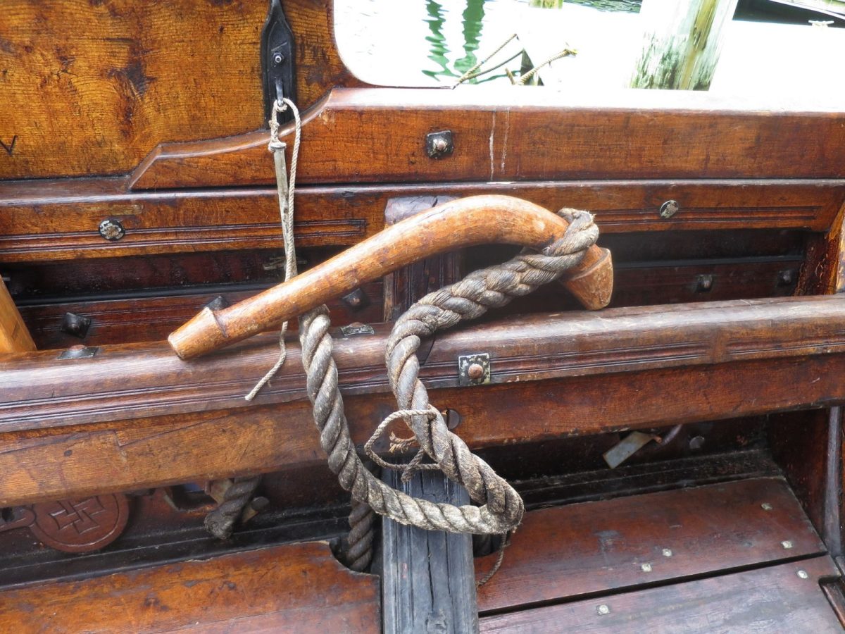 Pictured above is the Viking equivalent of a strop and shackle, able to hold down one the two short spars that extend over the forward rails to create fair leads for the clews of the huge square sail. I can’t recall it’s Norse name and can’t print what the crew call it (the crossword puzzle hint: “stallion appendage”).