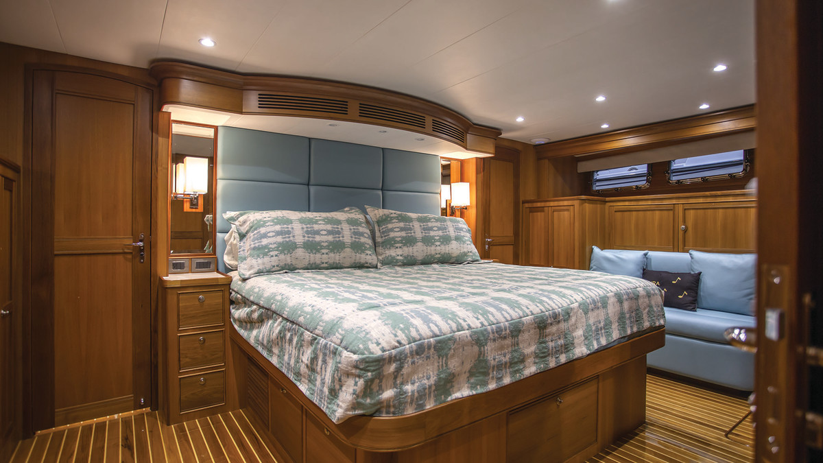 The master features a king berth, loads of stowage options, and a full-width head arrangement behind the bulkhead.