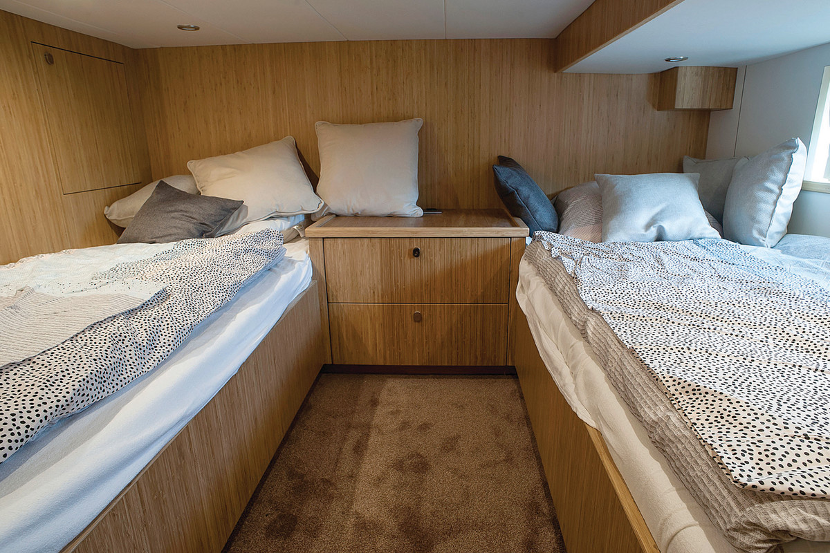 Second stateroom doesn’t carry much headroom, but both twin bunks are comfortable and adequate for guests or little ones