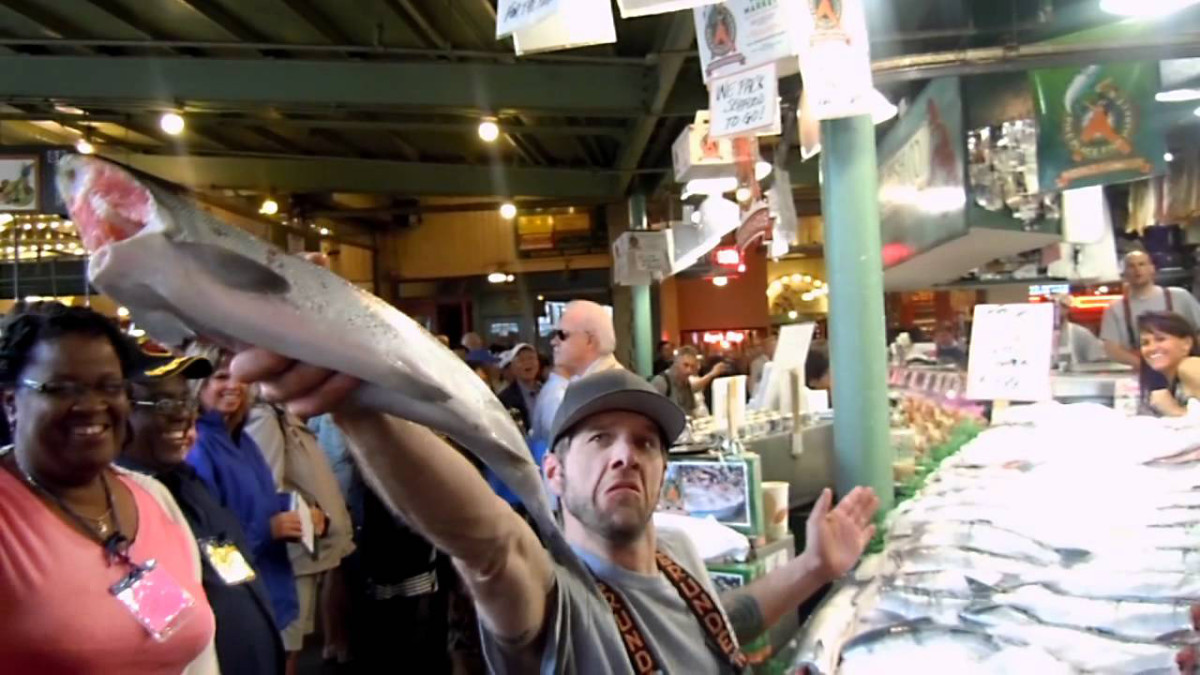Catching a thrown fish at the Pike Place Market.