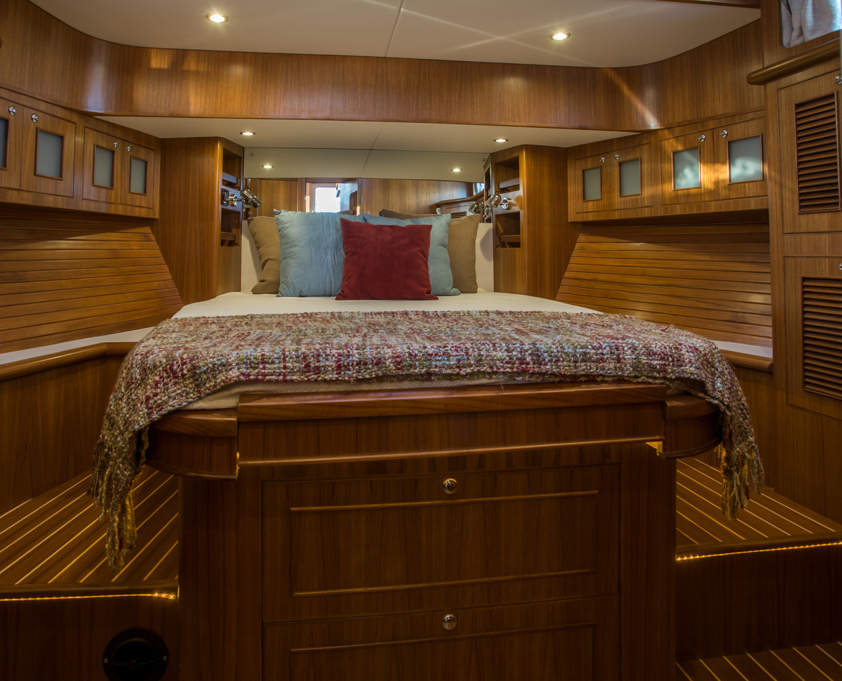 The master stateroom features an island queen sized bed and an abundance headroom.