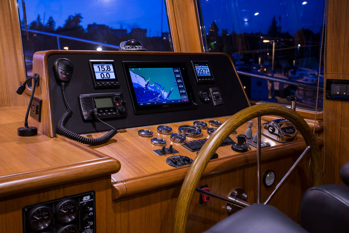 While this Sedan style 44 lacks a pilothouse, this helm station provides an additional seat for a companion.
