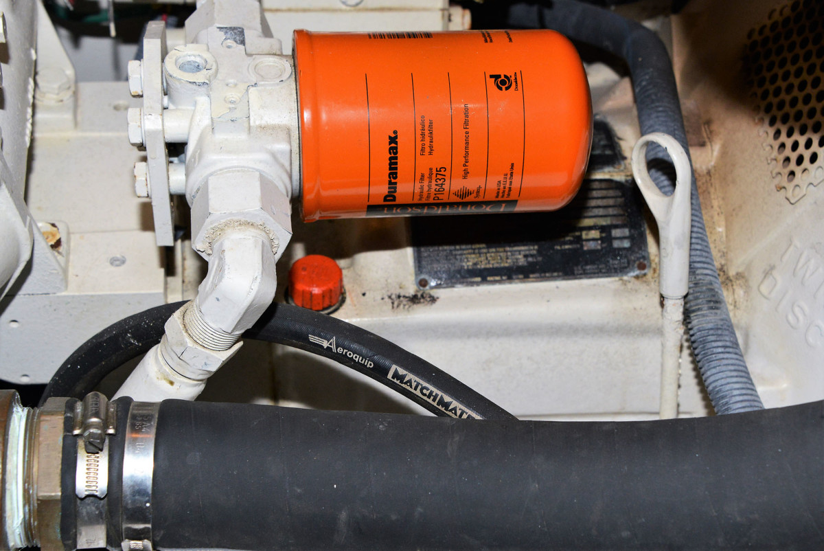 If you cannot run the engine or secure the shaft, you will need to take steps to protect the transmission. The dipstick opening must be sealed or plugged and the proper transmission oil added to the top of the fill opening (red cap in this image). Monitor the temperature closely during the tow.