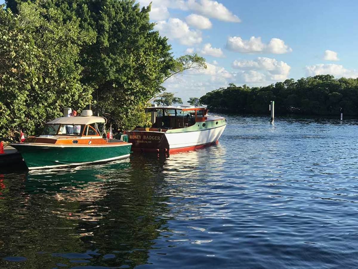 For many professionals in the business, collecting their own vintage boats is ‘an occupational hazard,’ Steve White says. Pictured with White’s 1931 38-foot Matthews, Honey Badger, is 1972 Hunt Surfhunter 26 Aurelia, whose restomod was executed by Bill Morong