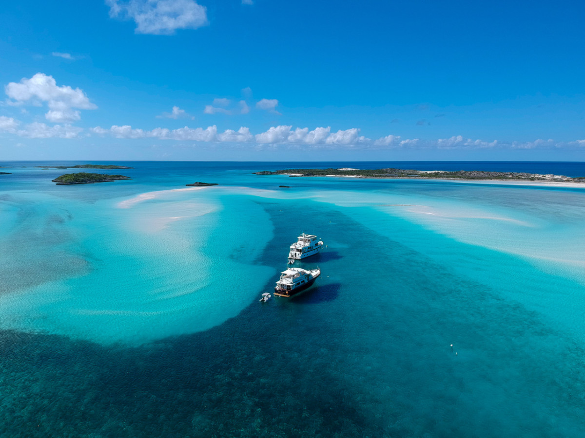 Trawlers traveling together share the solitude of a remote  anchorage at Warderick Wells in the Bahamas.