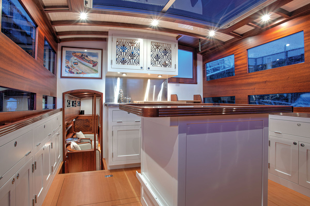 The original salon amidships was replaced by this galley with an island under an opening sunroof for morning coffee in the sunlight or an evening libation under the stars. 