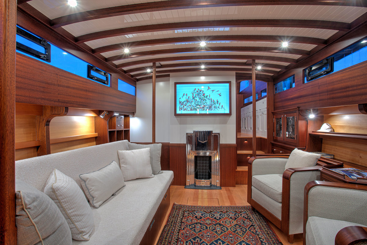 Part of the aft cabin was transformed into this salon with a lounge and an Art Deco-inspired fireplace.