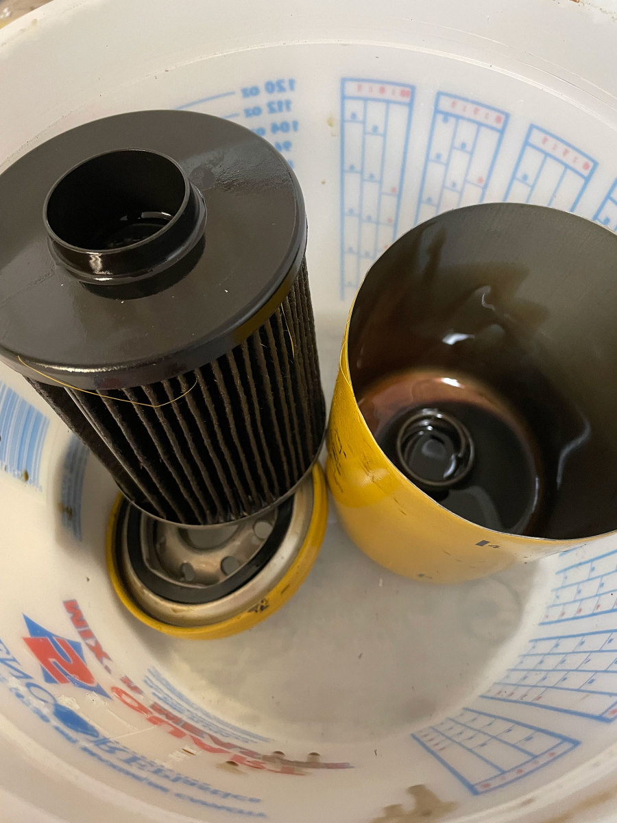 The top of this oil filter has been cut open to show the spring in the bottom. If the filter becomes too dirty, the spring collapses, allowing the filter to move toward the bottom and oil to bypass the seal in the top of the element—and the element itself.