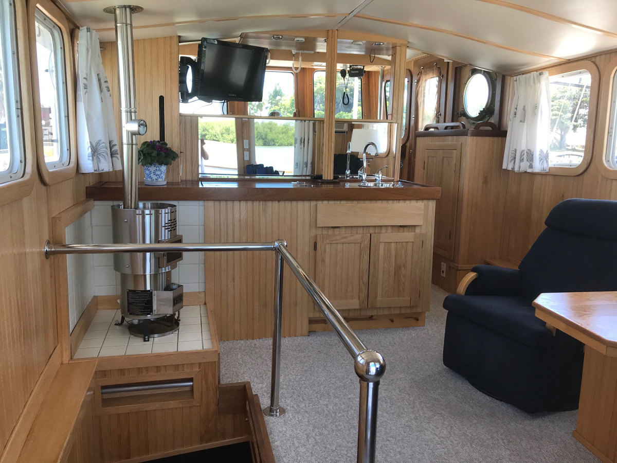 Bob and Sue Keehne converted a custom, flush-deck sailboat into a proper cruising powerboat. They owned a hardware store, which was a significant source of materials for the refit. 