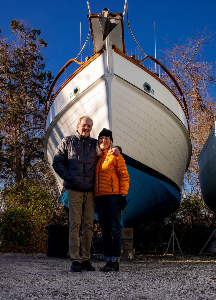 Onne and Tenley van der Wal strike a pose in front of their 1986 Grand Banks 32 Snow Goose.
