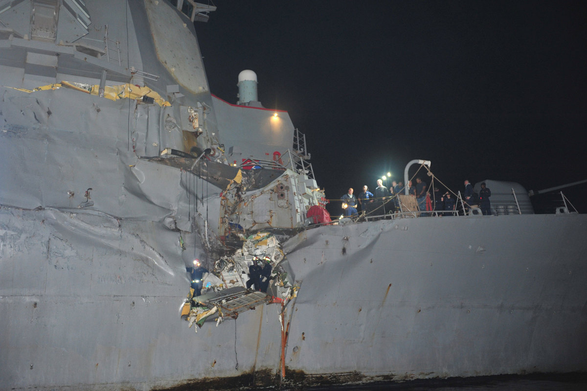The guided-missile destroyer USS Porter suffered significant damage after colliding with an oil tanker in the Strait of Hormuz. Facing page: Following an investigation of the incident, the commanding officer was relieved of command. Forunately, no one was seriously injured on either ship.
