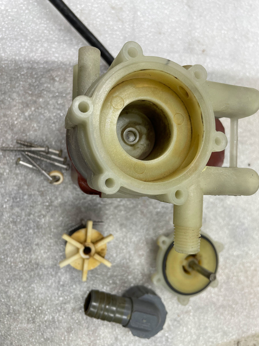 This disassembled seawater pump shows the efficient six-legged, magnetically driven impeller. The pumps are extremely reliable because the motor shaft does not extend into the wet portion of the pump. Consequently, there is no shaft seal to leak.