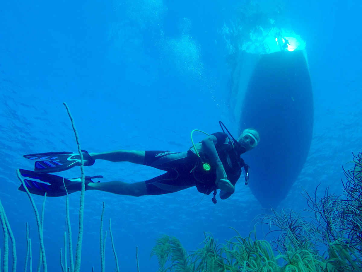 John diving directly under Ātea’s hull.