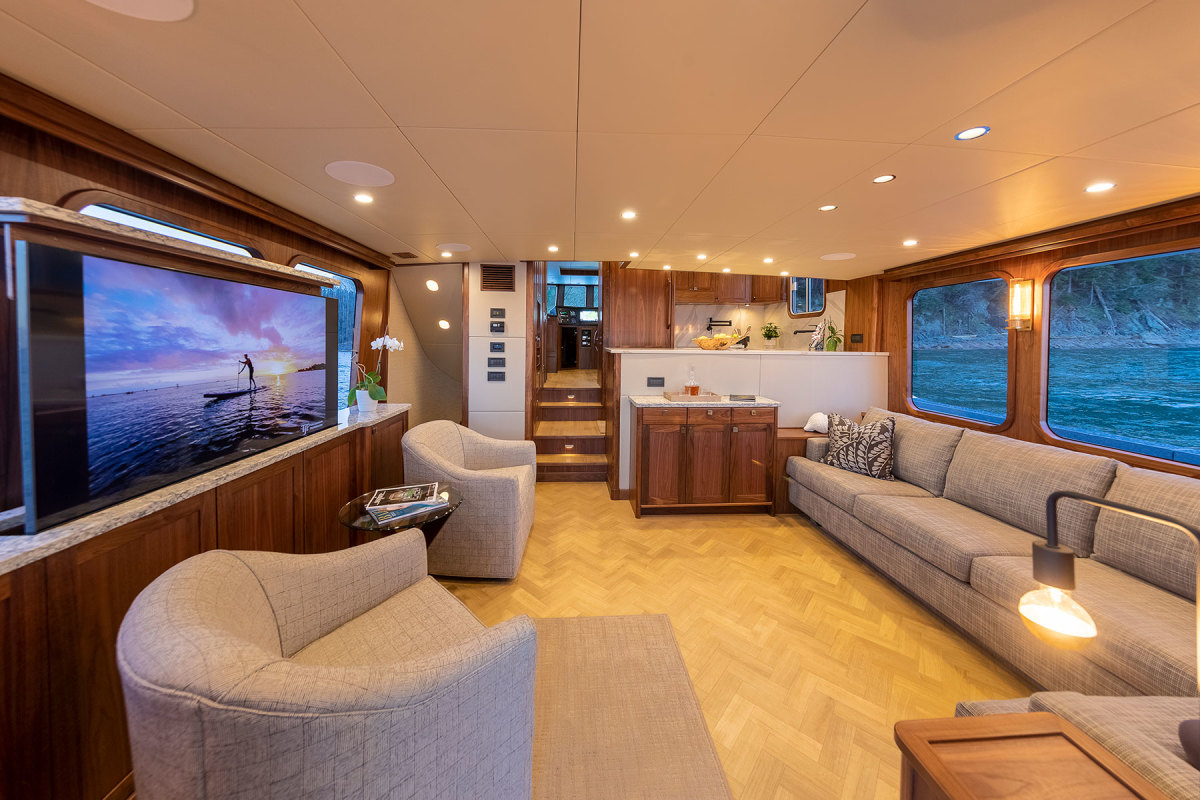 Hull No. 6 features a wide-body layout (all interiors are designed  by Mary Flores and Jan Whiting) with a airy salon that expands to nearly full beam. 