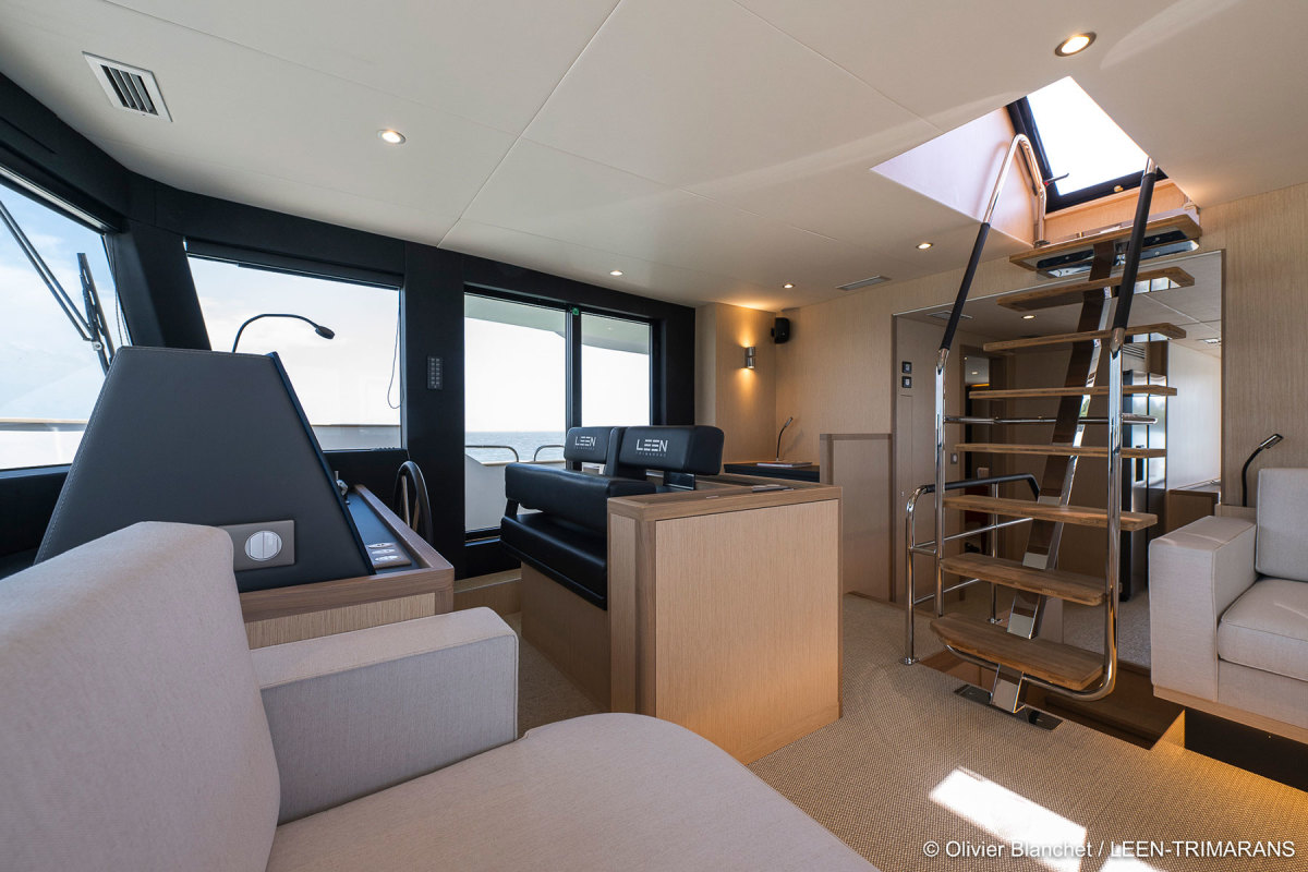 The wheelhouse, with its wraparound sofas, functions as a second salon