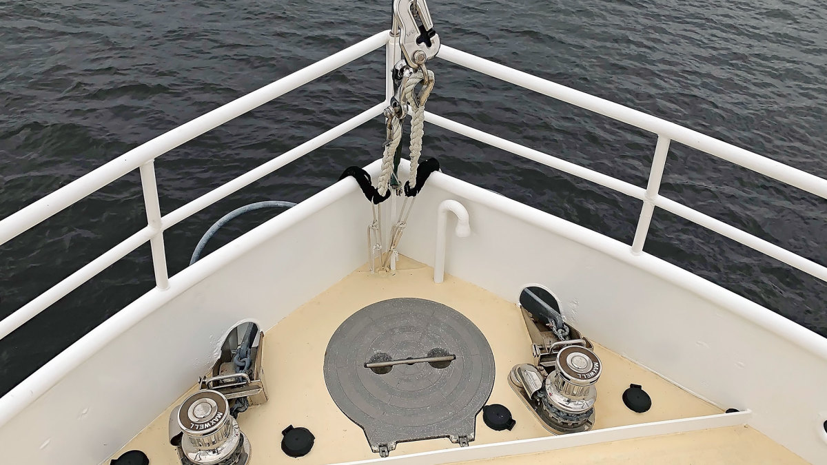 A variation on the arrangement would be two anchors with separate windlasses. It would still be prudent to carry bolt cutters to sever either chain rode in an emergency.