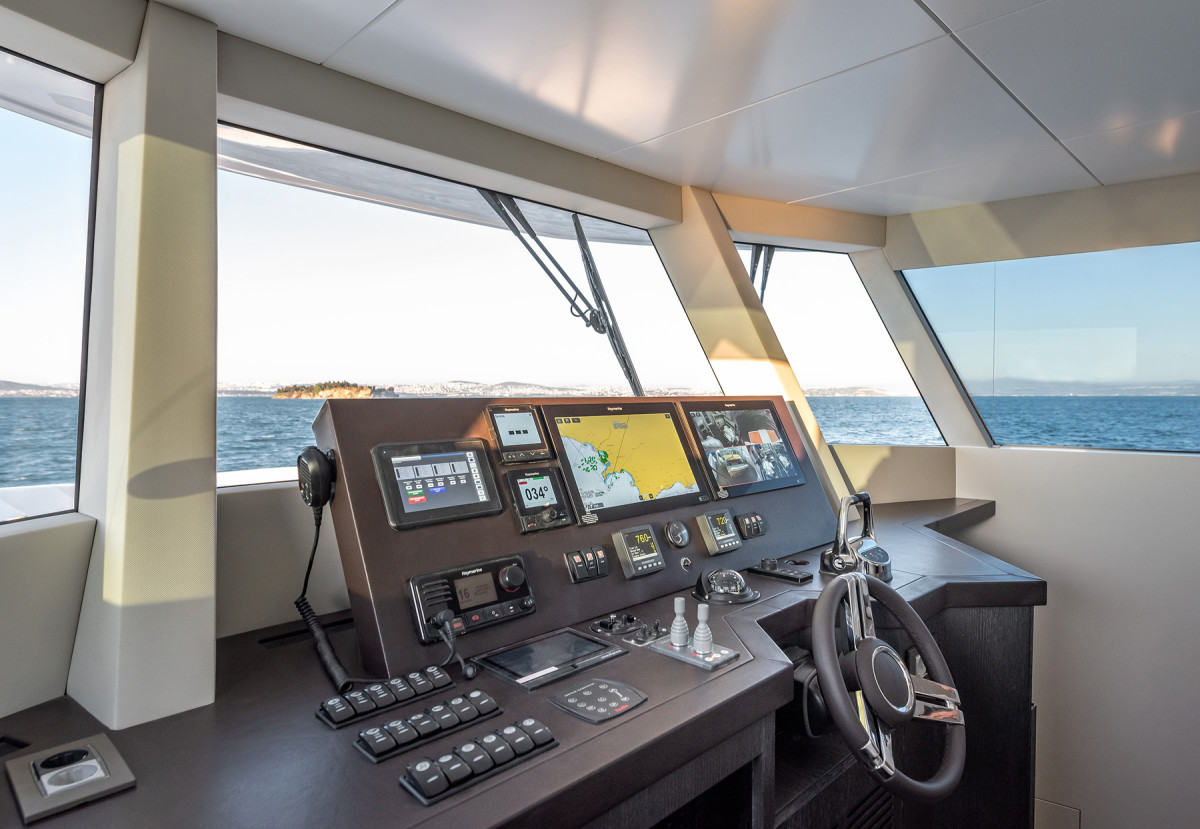 The inverted rake of the windshield at the helm helps clear water faster and augments a masculine profile. The owner has a choice of electronics packages, with a Raymarine suite as the standard offering.