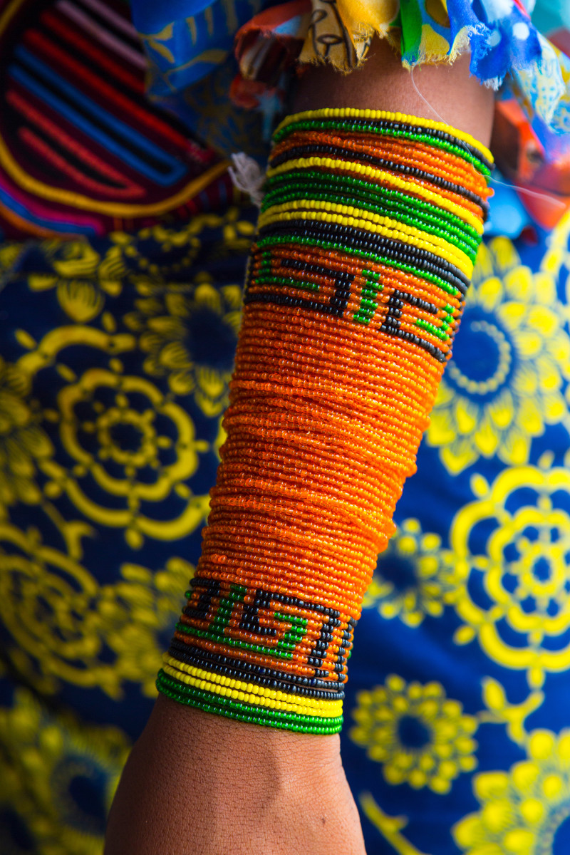 Most women still dress traditionally, with their wrists and ankles wrapped in multicolored beads.